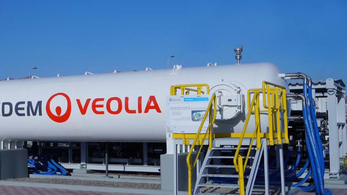 Veolia industrial water treatment unit with access stairs and pipelines