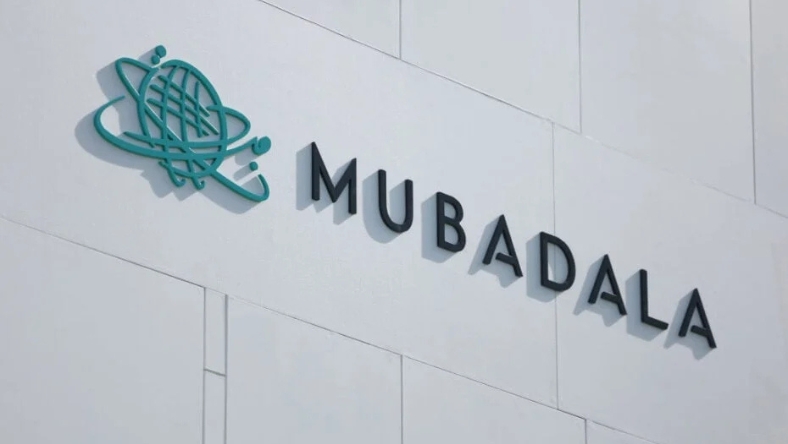 Mubadala logo displayed on the exterior wall of a modern office building