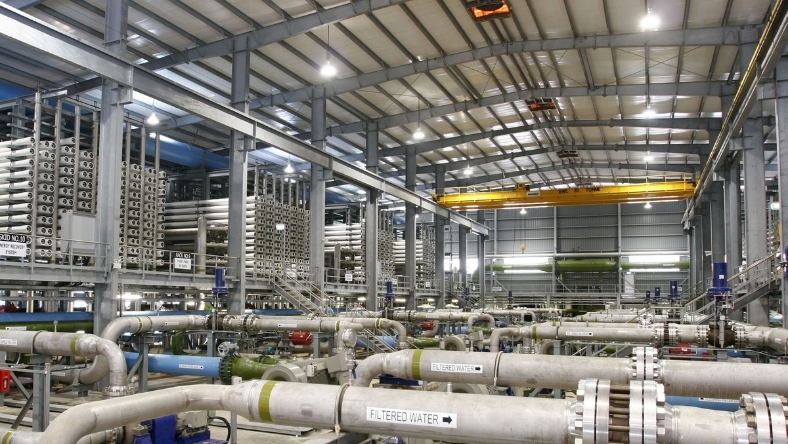 Produced water treatment facility with pipes and filtration systems