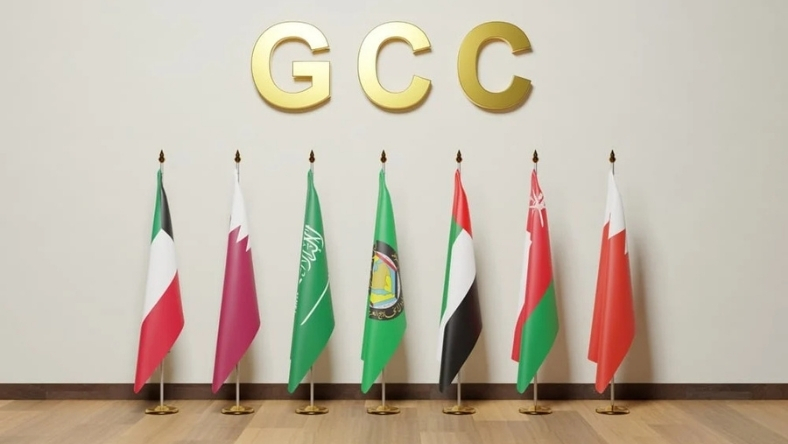 GCC council flags arranged below gold GCC letters
