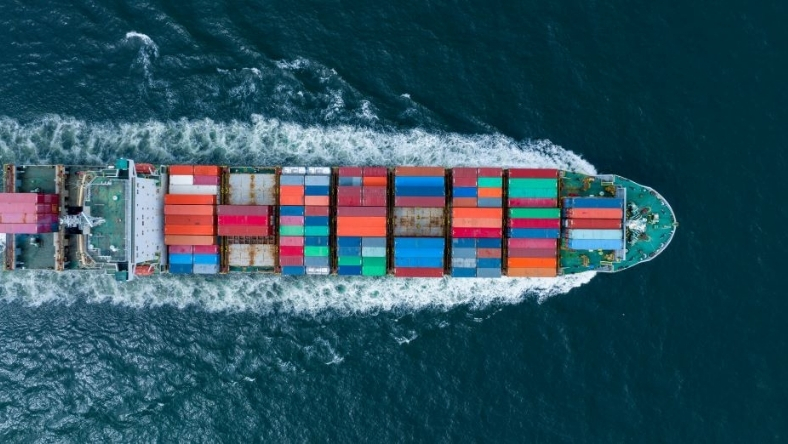 Aerial view of cargo ship with stacked containers