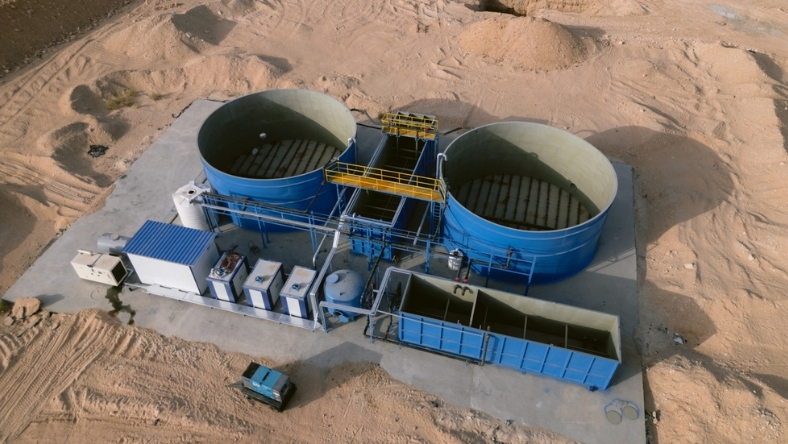 Industrial facility with circular wastewater tanks in desert setting